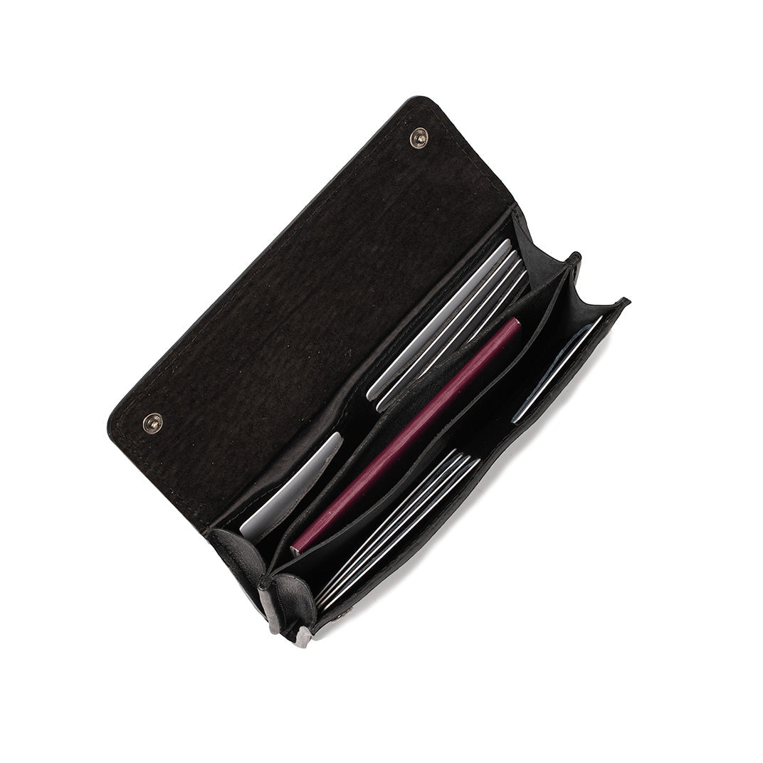 Black leather AirTag wallet open showing multiple compartments for cards and documents.
