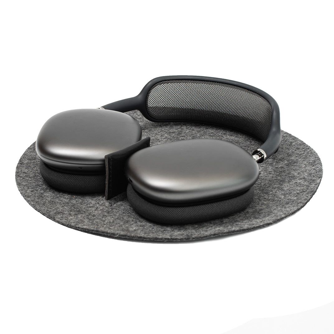 Side angle view of AirPods Max Rest Station in soft gray felt, designed to protect and organize AirPods Max.
