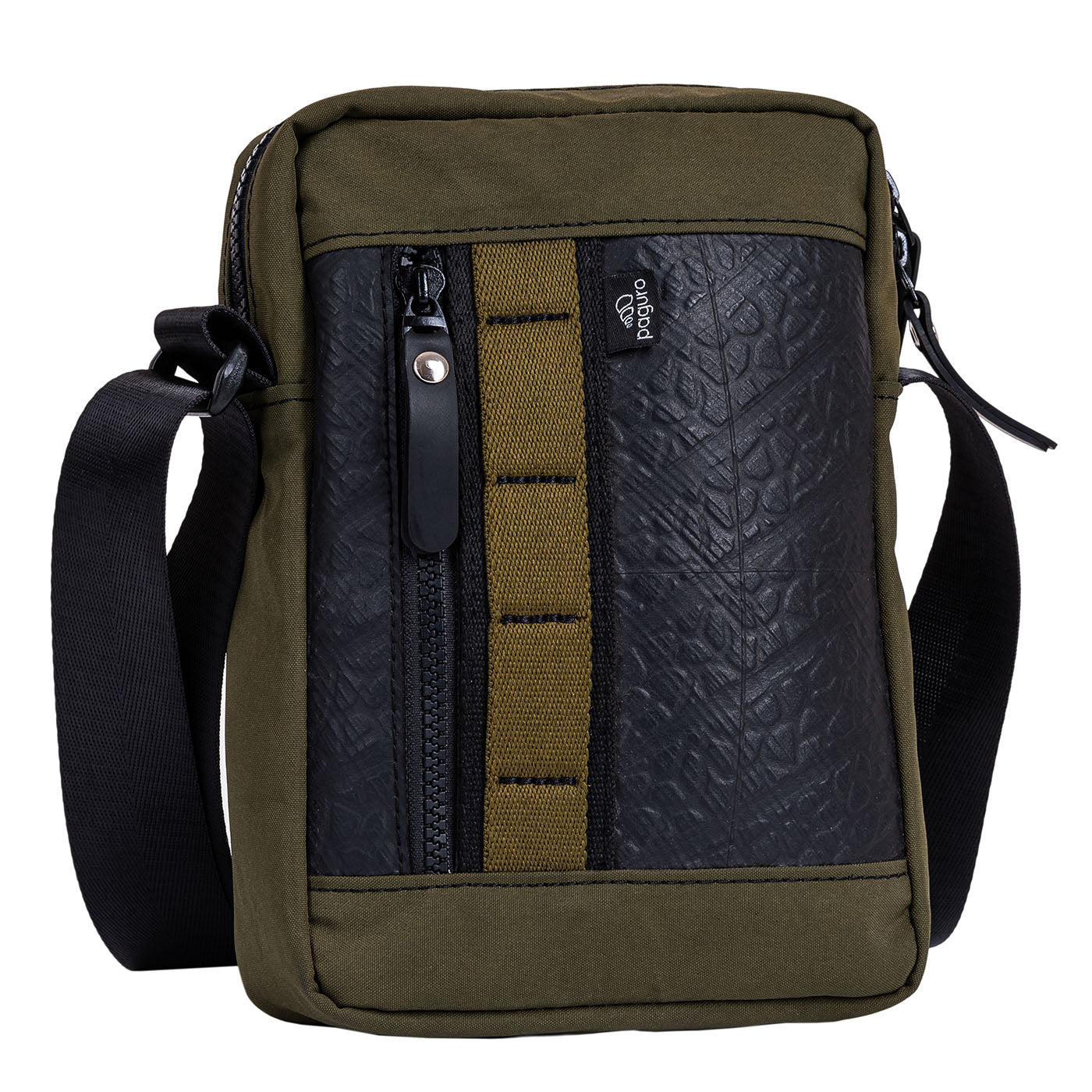 Eco-friendly handmade crossbody reporter bag crafted from upcycled rubber and reclaimed canvas, vegan fashion.