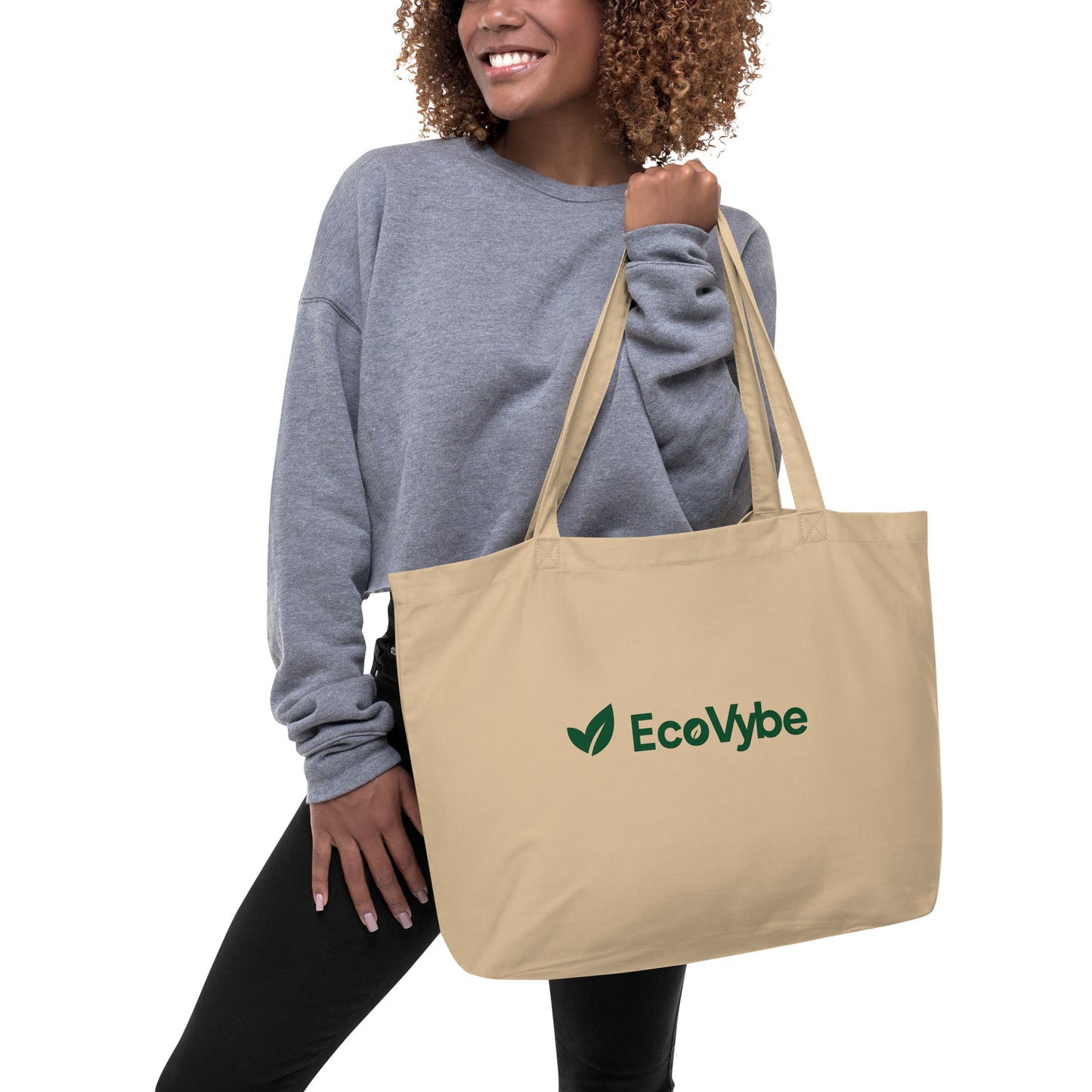 EcoVybe beige organic cotton tote bag worn by model.