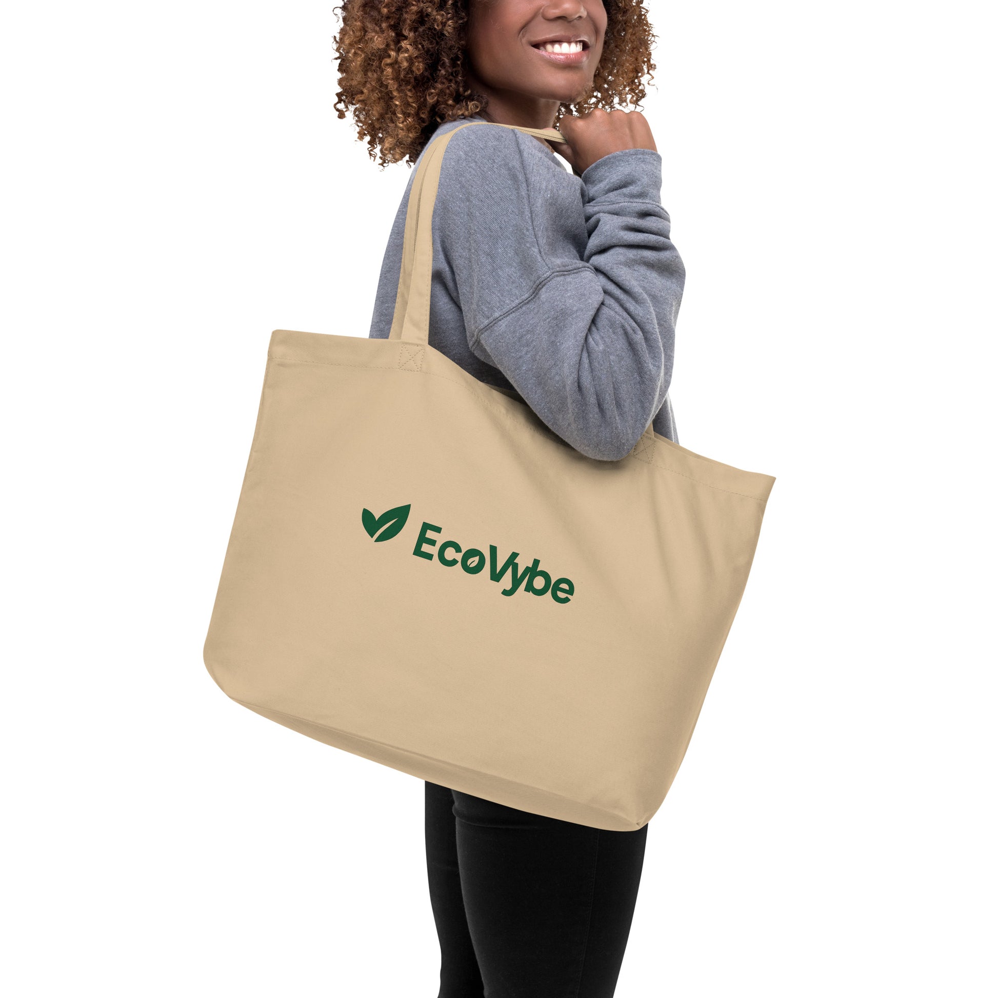 EcoVybe sustainable beige tote bag on shoulder – reusable shopper.