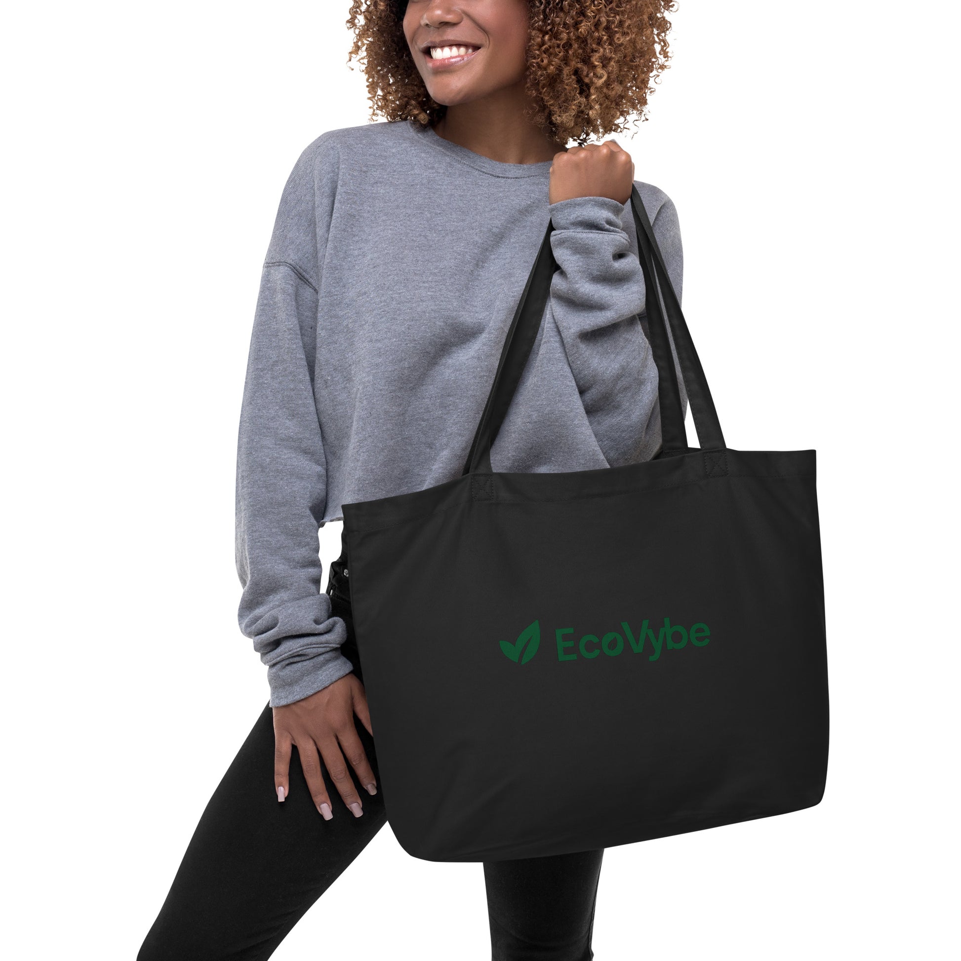 EcoVybe sustainable black tote bag on shoulder – reusable shopper.