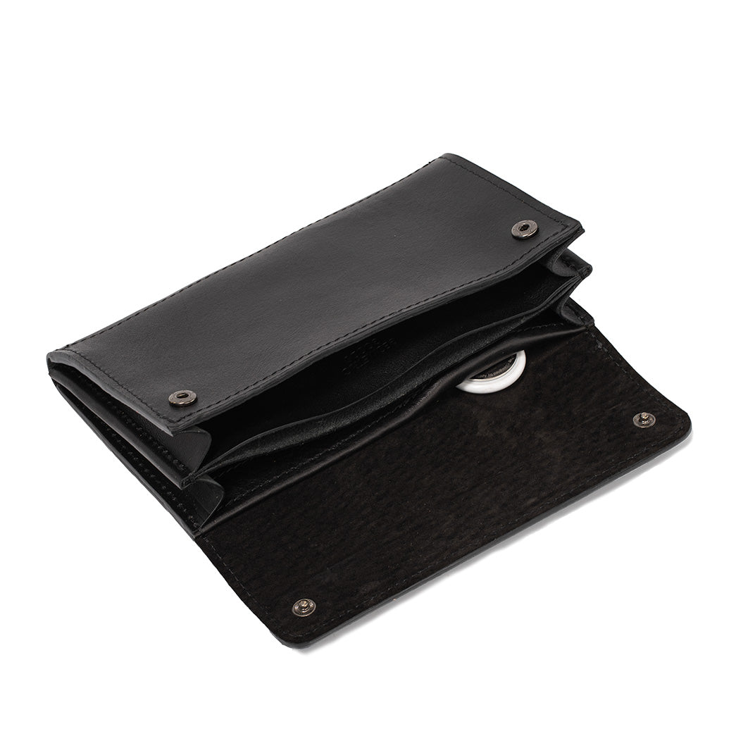 Black leather AirTag wallet open with secret AirTag pocket visible.