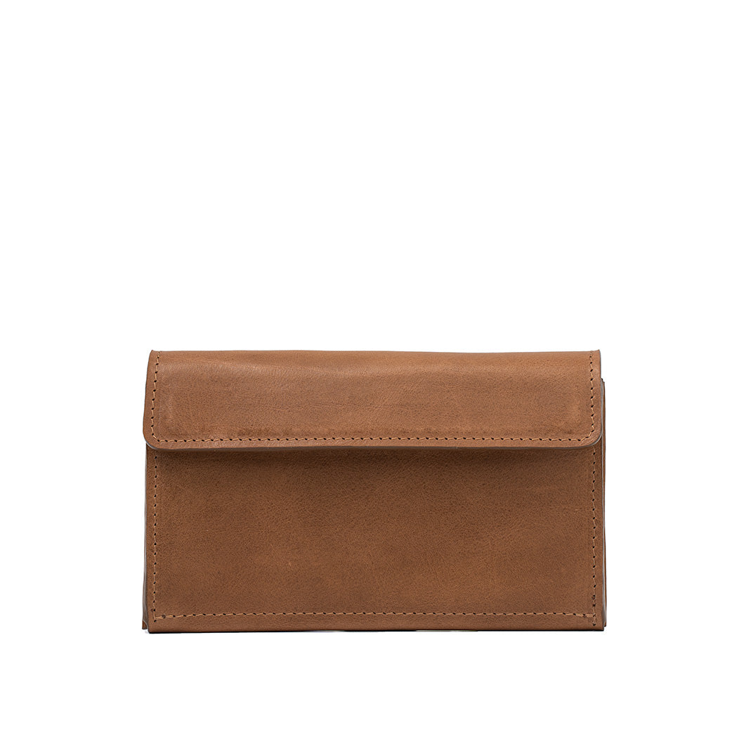 Brown leather AirTag wallet, closed front view on white background.