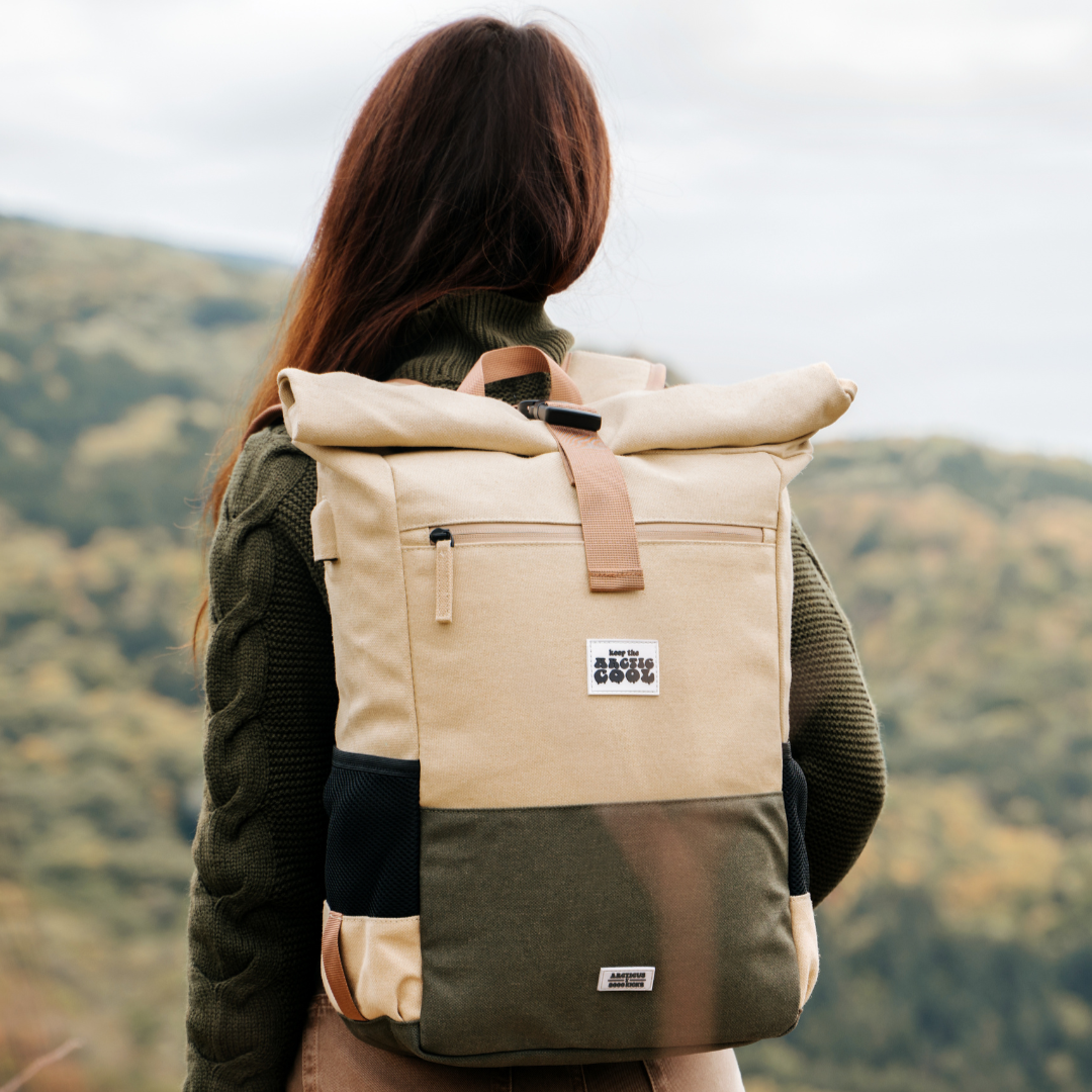 Polar Explorer Backpack beige hemp waterproof design, held outdoors in nature, eco travel backpack.