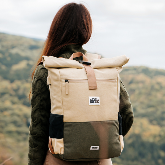 Polar Explorer Backpack beige hemp waterproof design, held outdoors in nature, eco travel backpack.