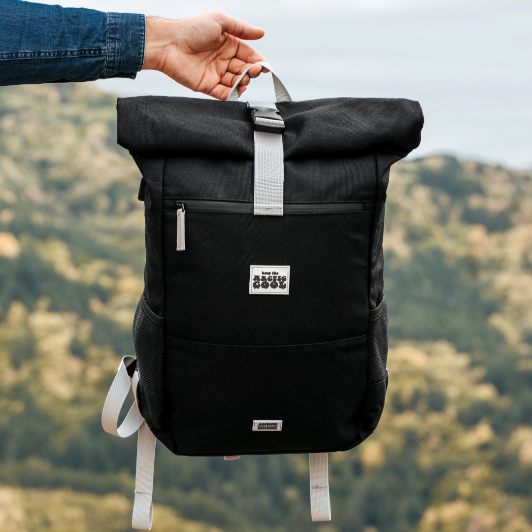 Polar Explorer Backpack black hemp waterproof design, held outdoors in nature, eco travel backpack.