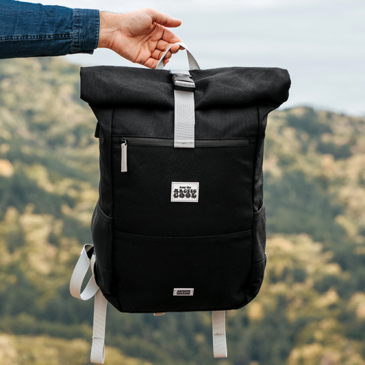 Polar Explorer Backpack black hemp waterproof design, held outdoors in nature, eco travel backpack.